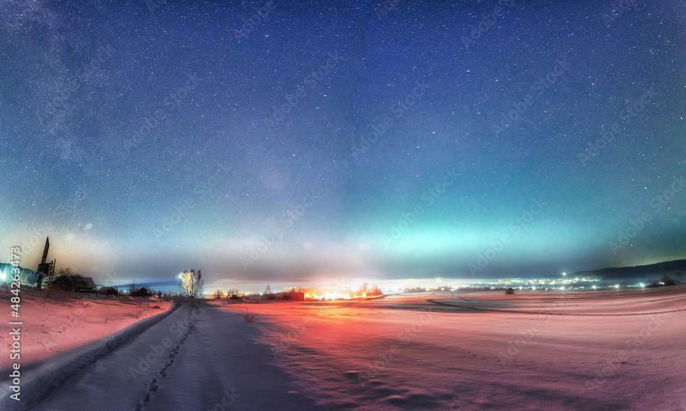landscape with starry sky over the town at january night in Permsky kray, Russia