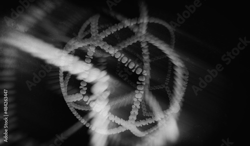 abstract volumetric composition - a ribbon of repeating icons tangled into a ball, monochrome, a blurry image, 3d render