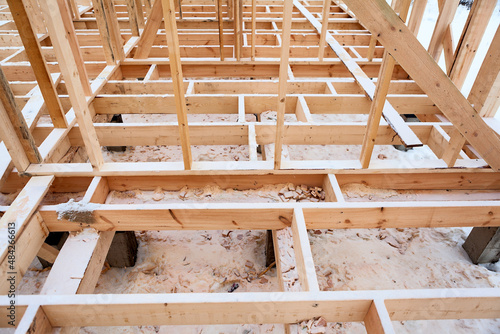 Details of wooden base and floor covering of a frame house photo