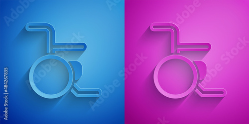 Paper cut Wheelchair for disabled person icon isolated on blue and purple background. Paper art style. Vector