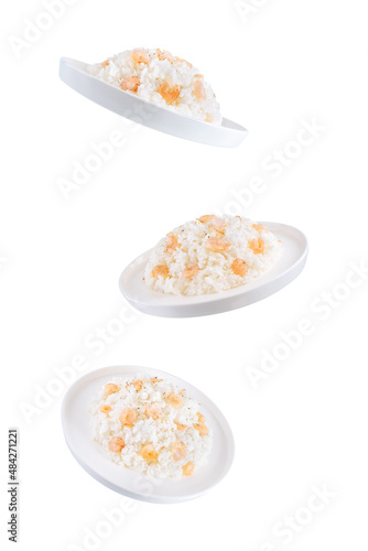 Garlic cream shrimp rice in a plate on a white isolated background