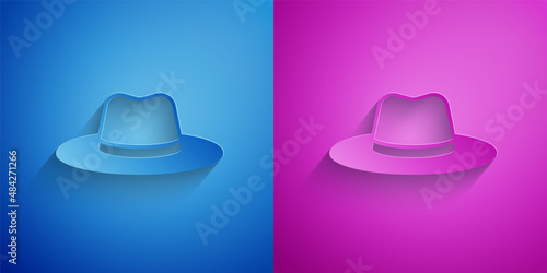 Paper cut Man hat with ribbon icon isolated on blue and purple background. Paper art style. Vector