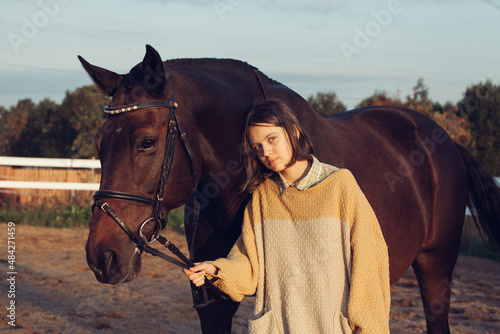 Wallpaper Mural A young girl with a short haircut next to her horse at sunset. Good friends. Summer and happiness. Torontodigital.ca