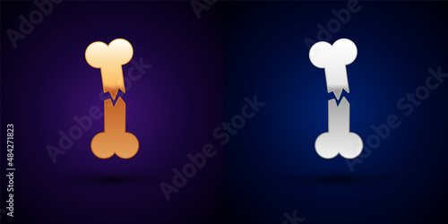 Gold and silver Human broken bone icon isolated on black background. Vector