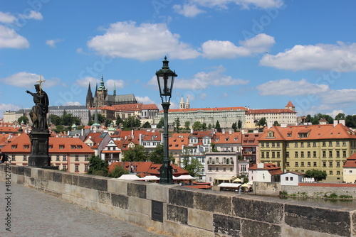 View from Charles bridge , Prague Castle with lamp and statue in summer