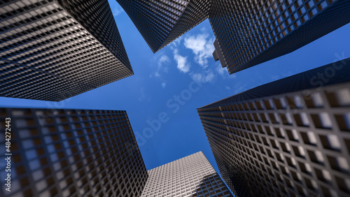 Glass buildings with cloudy blue sky background. Business concept of industry tech architecture. 3d rendering. 3d illustration