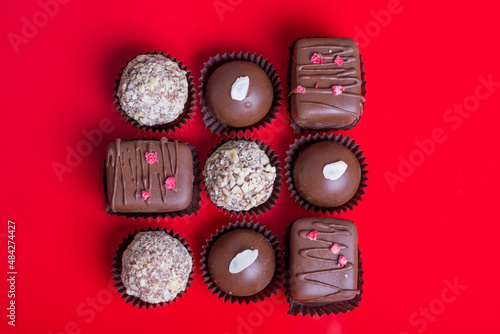 Composition of chocolate, red background