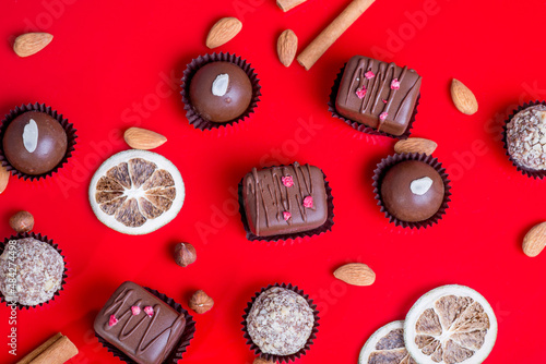 Composition of chocolate, red background