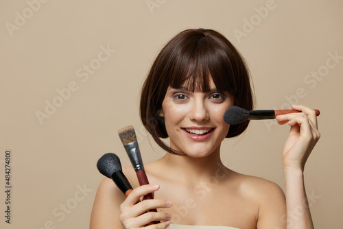 woman brushe cosmetics attractive look posing isolated background