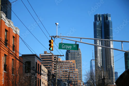 Green big Grove Street sign hanging on a arch pole in the streets of downtown Jersey City photo