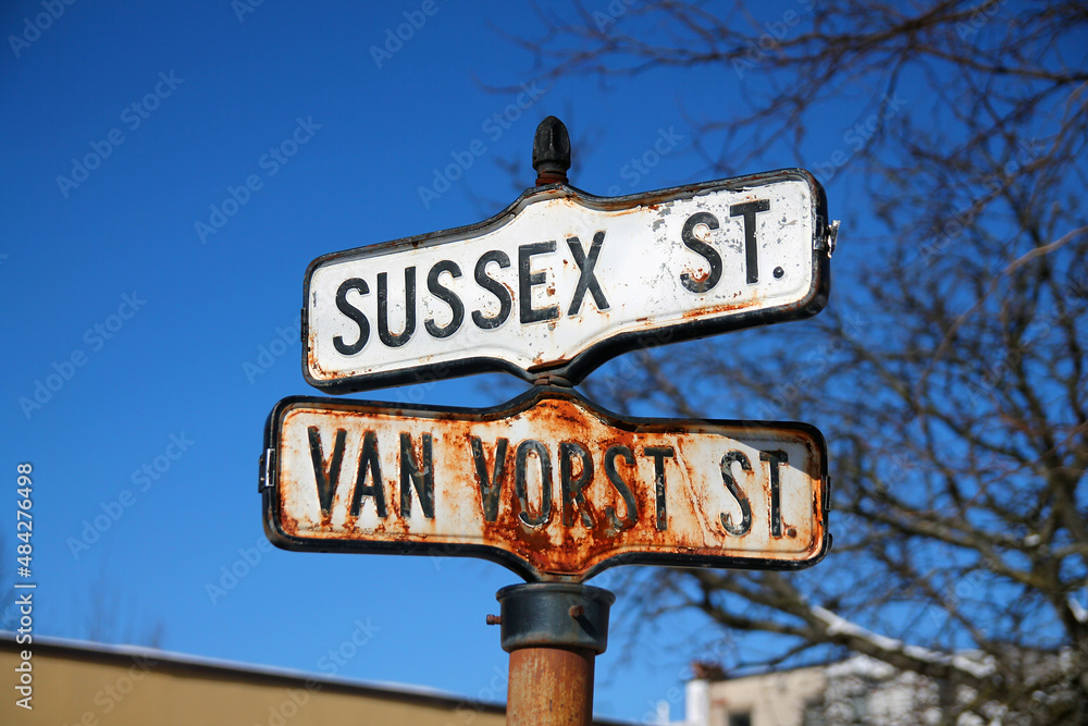 Historical, traditional and rust Sussex Street and Van Vorst Street iron sign in Paulus Hook Historical, traditional and rust Sussex Street and Van Vorst Street iron sign in Paulus Hook
