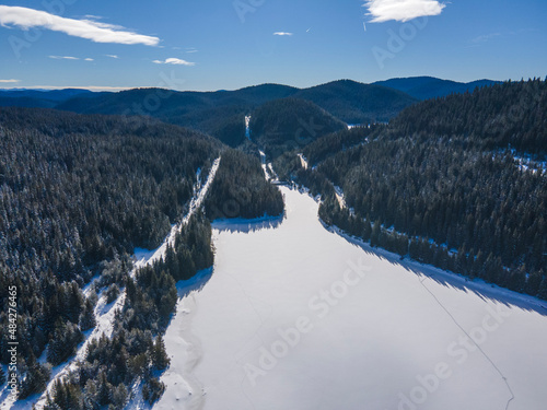 Aerial winter view of Beglika Reservoir covered with ice, Bulgaria photo