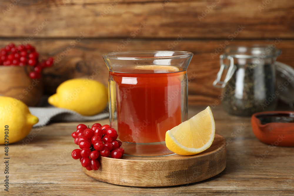 Immunity boosting drink and ingredients on wooden table Immunity boosting drink and ingredients on wooden table