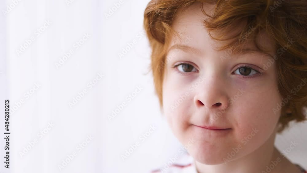 closeup of redhead boy's face. Five years old kid closeup of redhead boy's face. Five years old kid