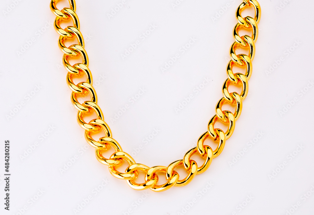 Obraz premium gold jewelry. Gold chain on background