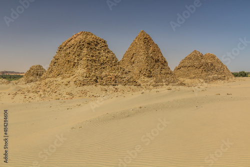 View of dilapidated pyramids of Nuri in the desert near Karima town, Sudan photo