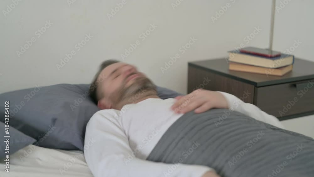 Man Waking up from Nightmare in Bed Man Waking up from Nightmare in Bed