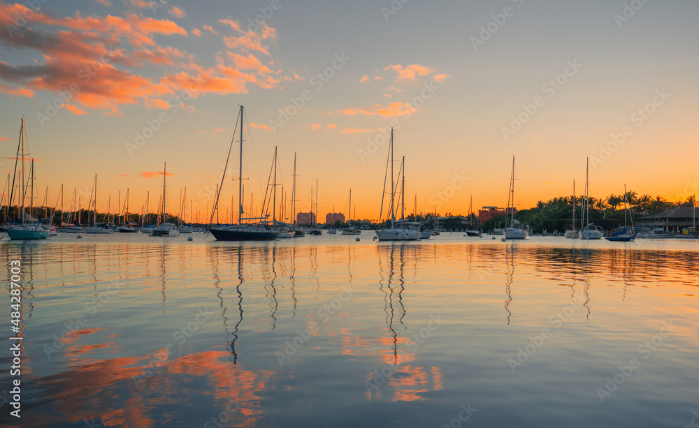 sunset at the marina beautiful boats water reflections colors port sky clouds 