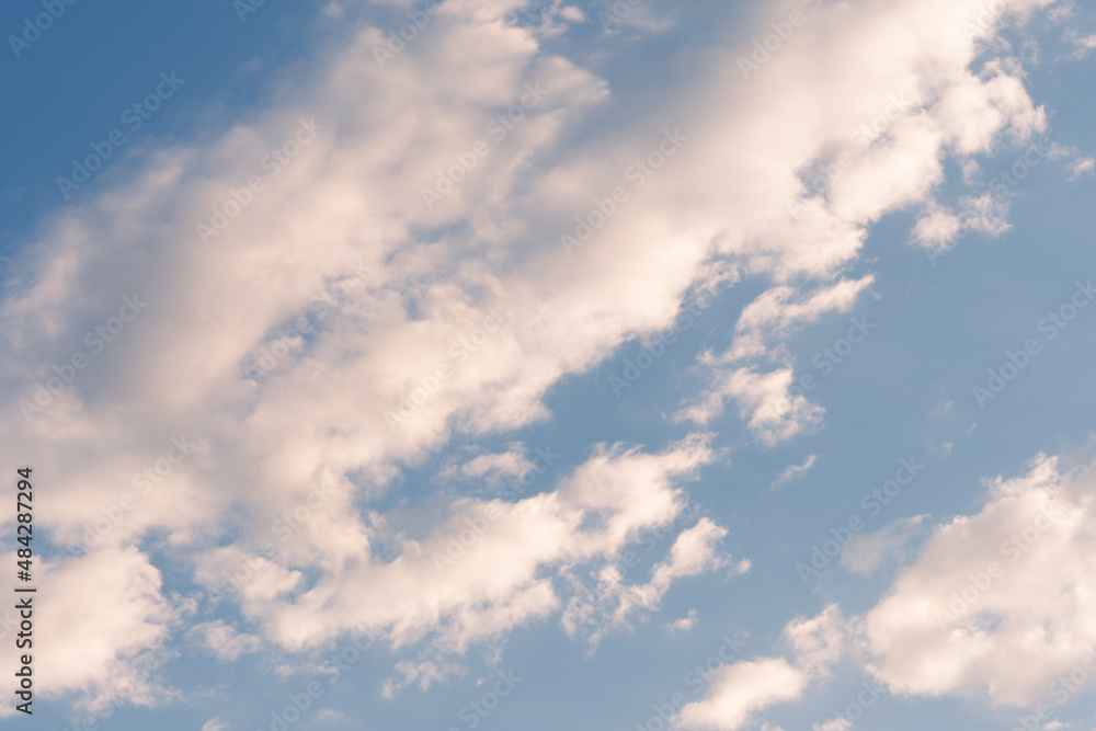 Fototapeta premium Background of a celestial sky with white clouds