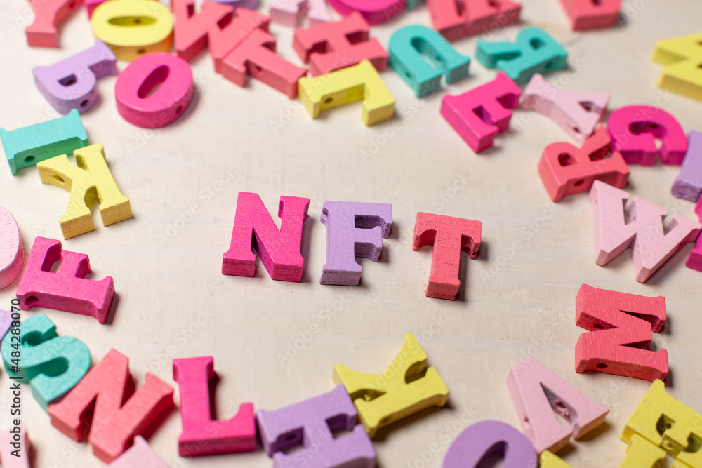Obraz premium nft letters on light wooden background