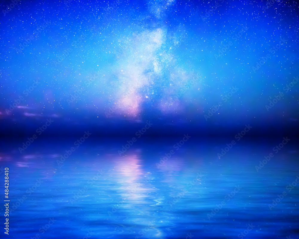 The Milky Way rises above milky blue calm waters The Milky Way rises above milky blue calm waters