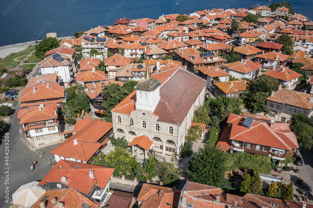 Dormition of Theotokos Church and houses in Old Town of Nesebar city in Bulgaria