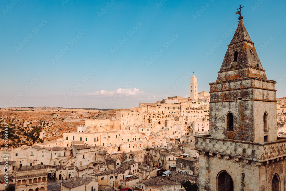 Panoramic view of the Sassi di Matera from the Belvedere di San Pietro Barisano, blue sky with clouds