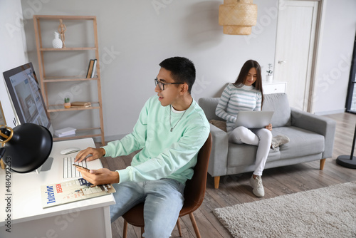 Young man with mobile phone...