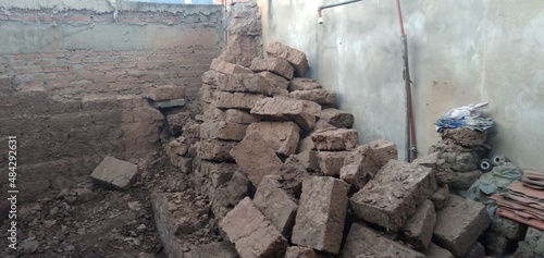 Adobes of earth and straw piled up in an old house in Samaipata in Bolivia.