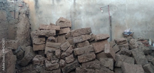 Adobes of earth and straw piled up in an old house in Samaipata in Bolivia.