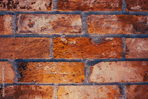 Close up on a wall made of old bricks