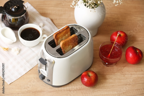 White toaster with bread sl...