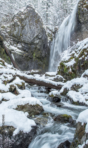 winter waterfall and stream in the snow