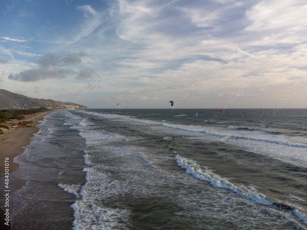Water sport at cold winter water of Tyrrhenian sea between two touristic towns Sperlonga and Terracina in Lazio, Italy, aerial view Water sport at cold winter water of Tyrrhenian sea between two touristic towns Sperlonga and Terracina in Lazio, Italy, aerial view