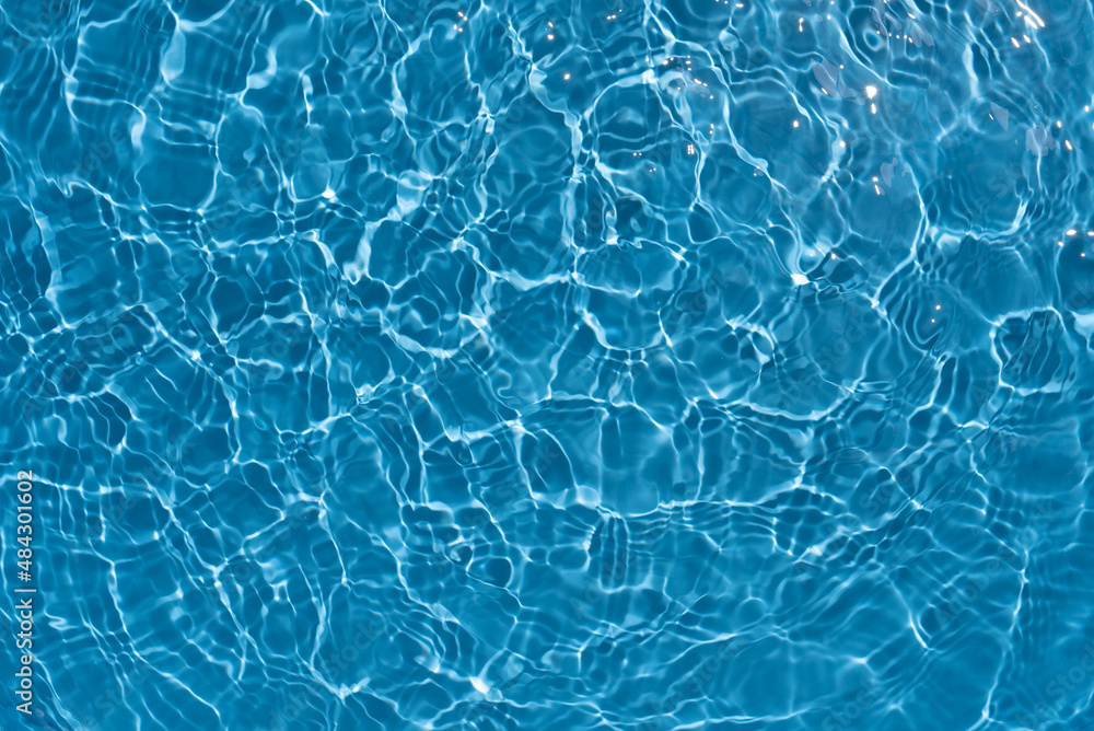Shining blue water ripple background. Summer concept.