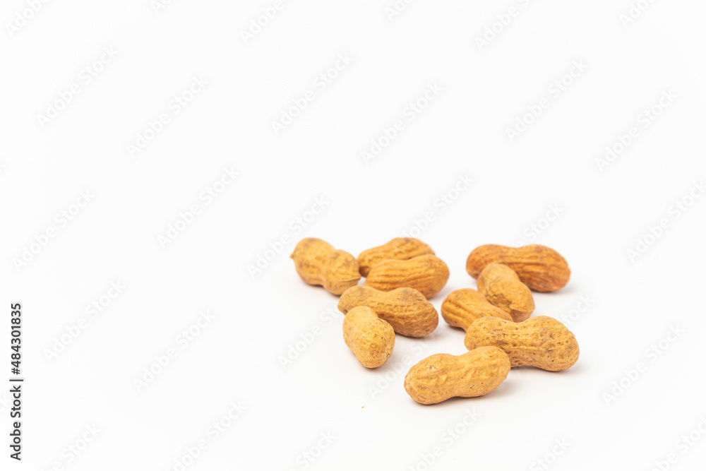 Peanuts on a white background with copy space. Peanuts on a white background with copy space.