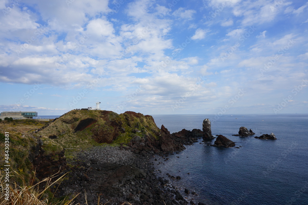 rocky coast and lighthouse