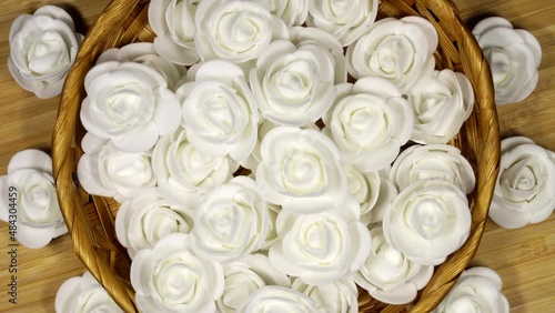 White decorative roses, rotation background. Close up