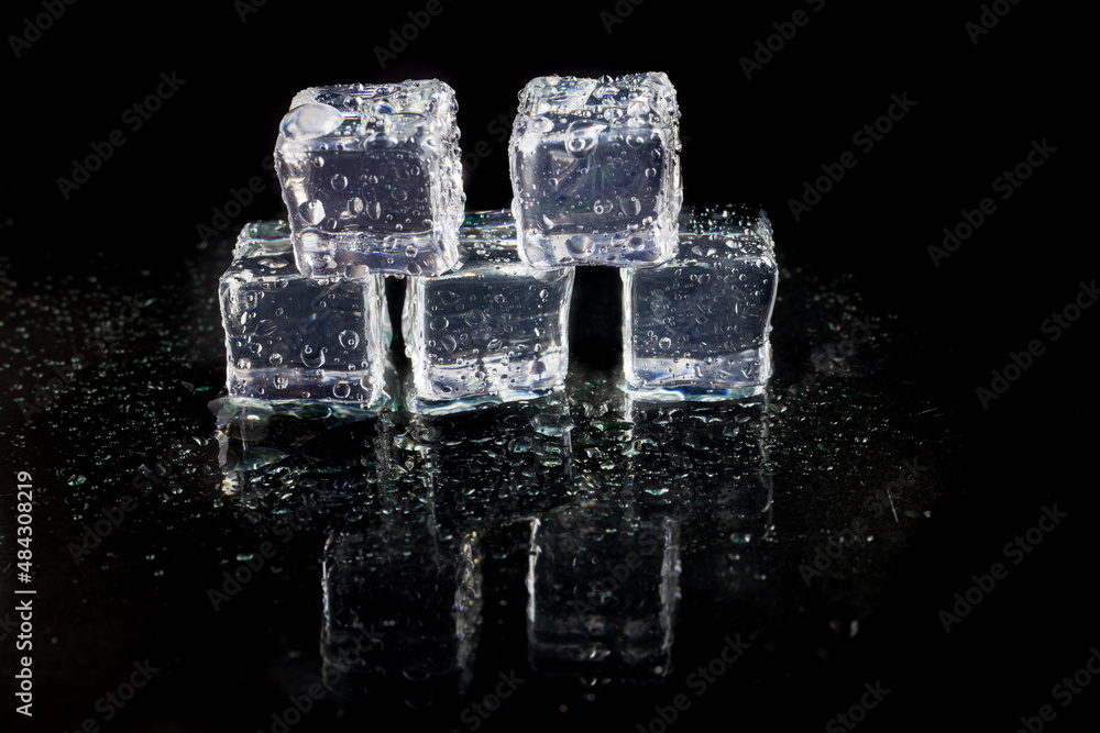 Shining ice cubes on black background. Shining ice cubes on black background.