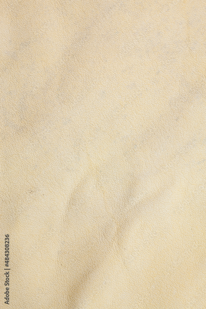 Beige real leather background.
