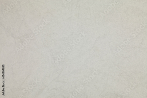 Crumpled white paper background.