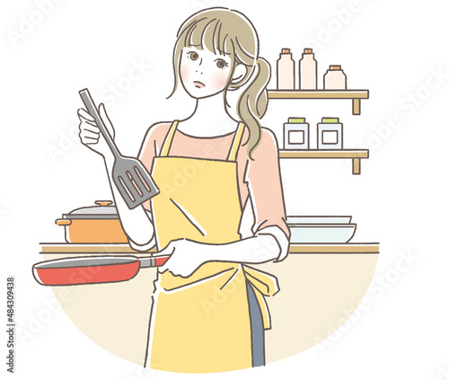 料理をする困った顔の女性