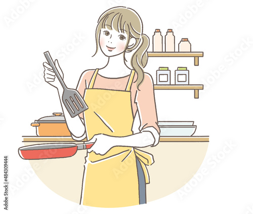 料理する笑顔の女性