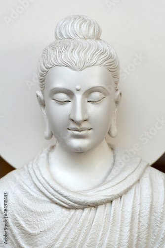 face of white stone buddha