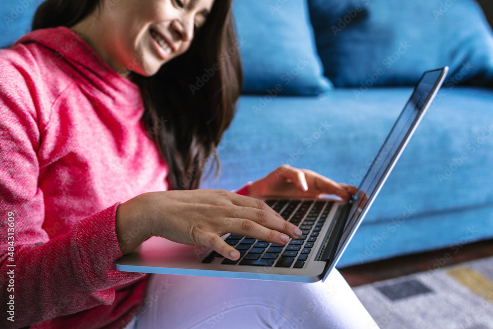 Young hispanic woman working or studying with laptop at home in a home office concept in Mexico Latin America Young hispanic woman working or studying with laptop at home in a home office concept in Mexico Latin America