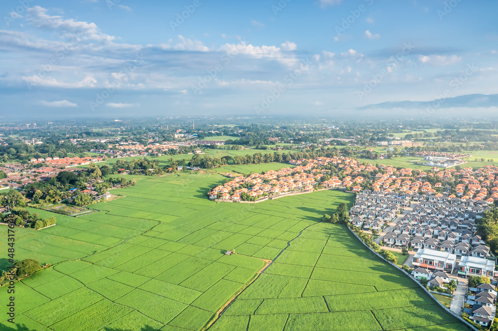 Land or landscape of green field in aerial view. Include agriculture farm, house building, village. That real estate or property. Plot of land to housing subdivision, development, sale or investment.
