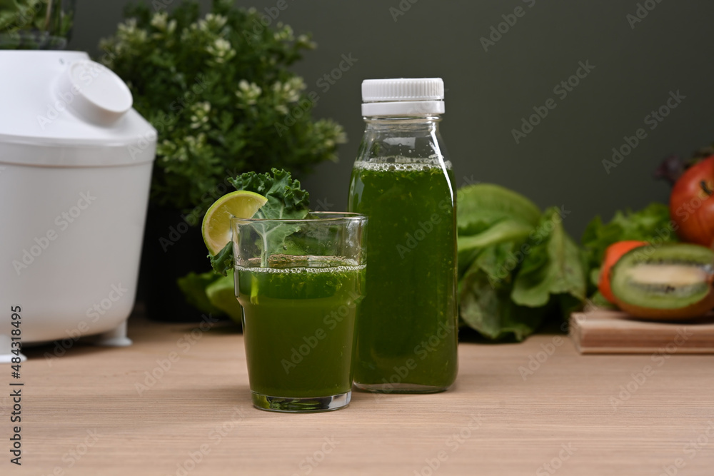 Fresh healthy vegetables smoothie with organic fruits and vegetables on wooden table. Fresh healthy vegetables smoothie with organic fruits and vegetables on wooden table.