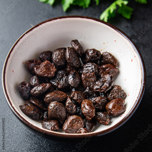 olives black pitted dried fruit smoked food snack on the table copy space food background 