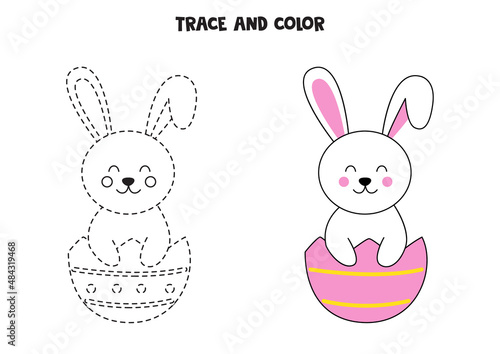 Trace and color cute Easter bunny sitting in eggshell. Worksheet for children.