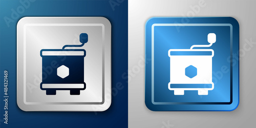 White Honey extractor icon isolated on blue and grey background. Mechanical device for honey extraction from honeycombs. Silver and blue square button. Vector